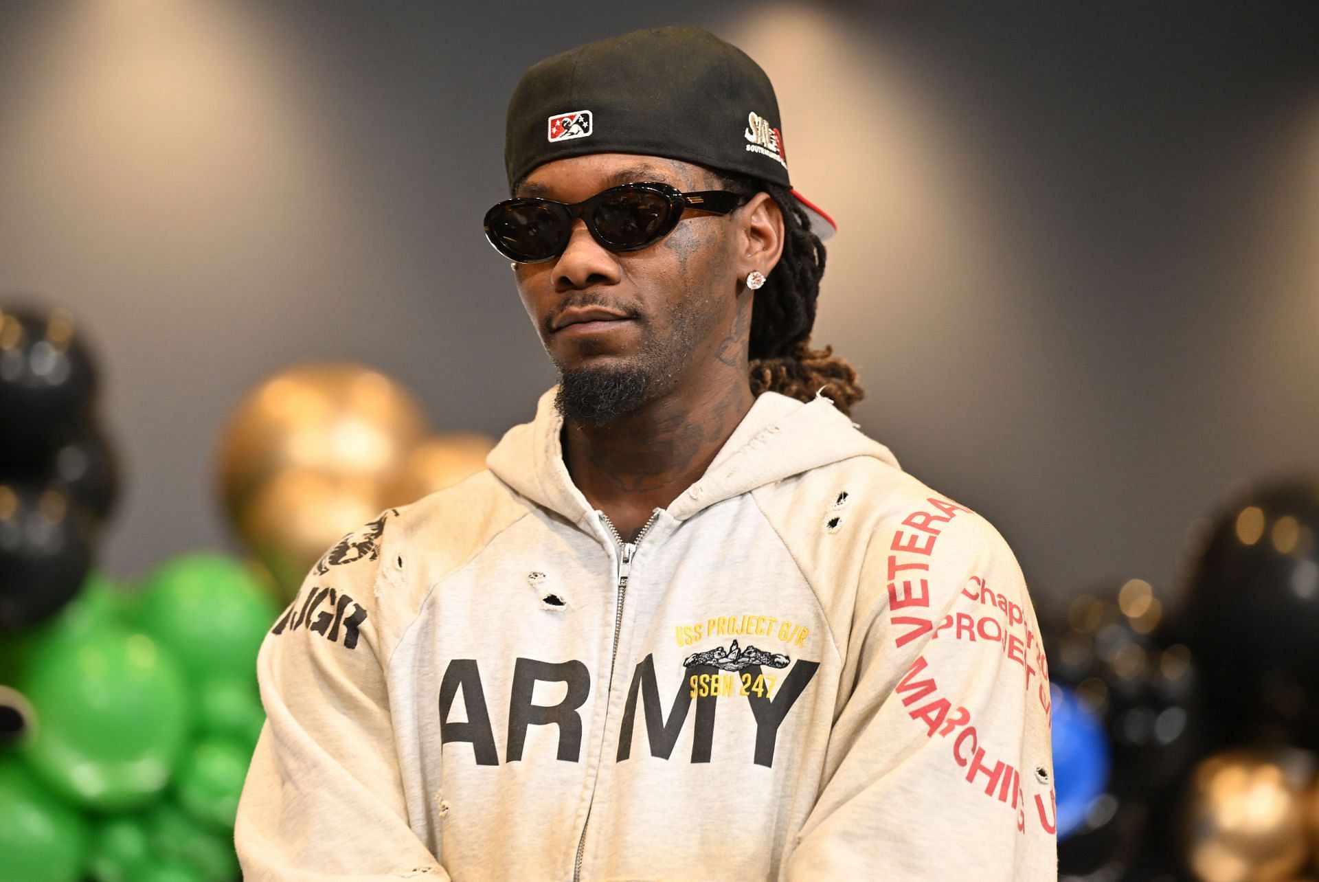 Offset at the Nouveau Bar & Grill Winter Wonderland Experience Holiday Toy Drive. (Image via Getty)